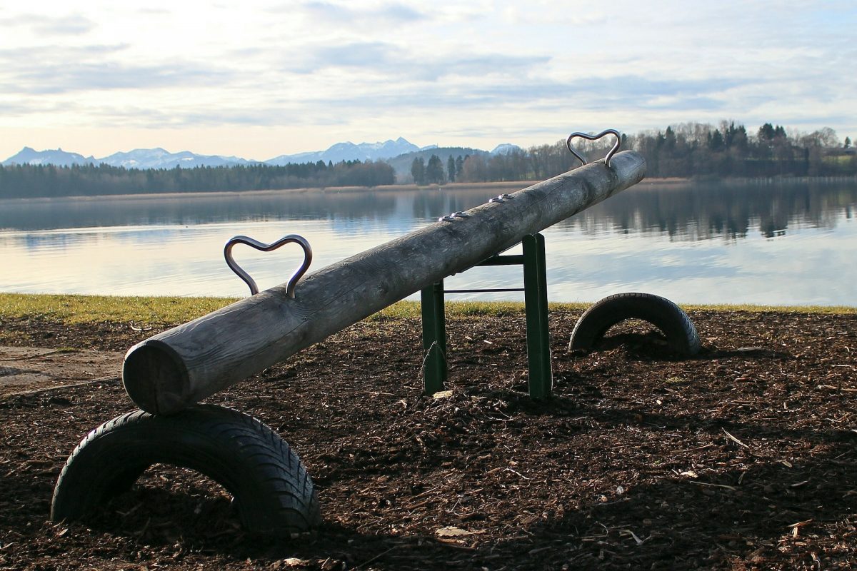 seesaw in front of water