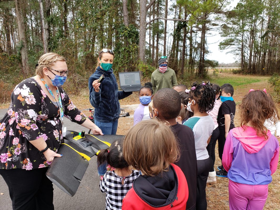 Children learning about drones